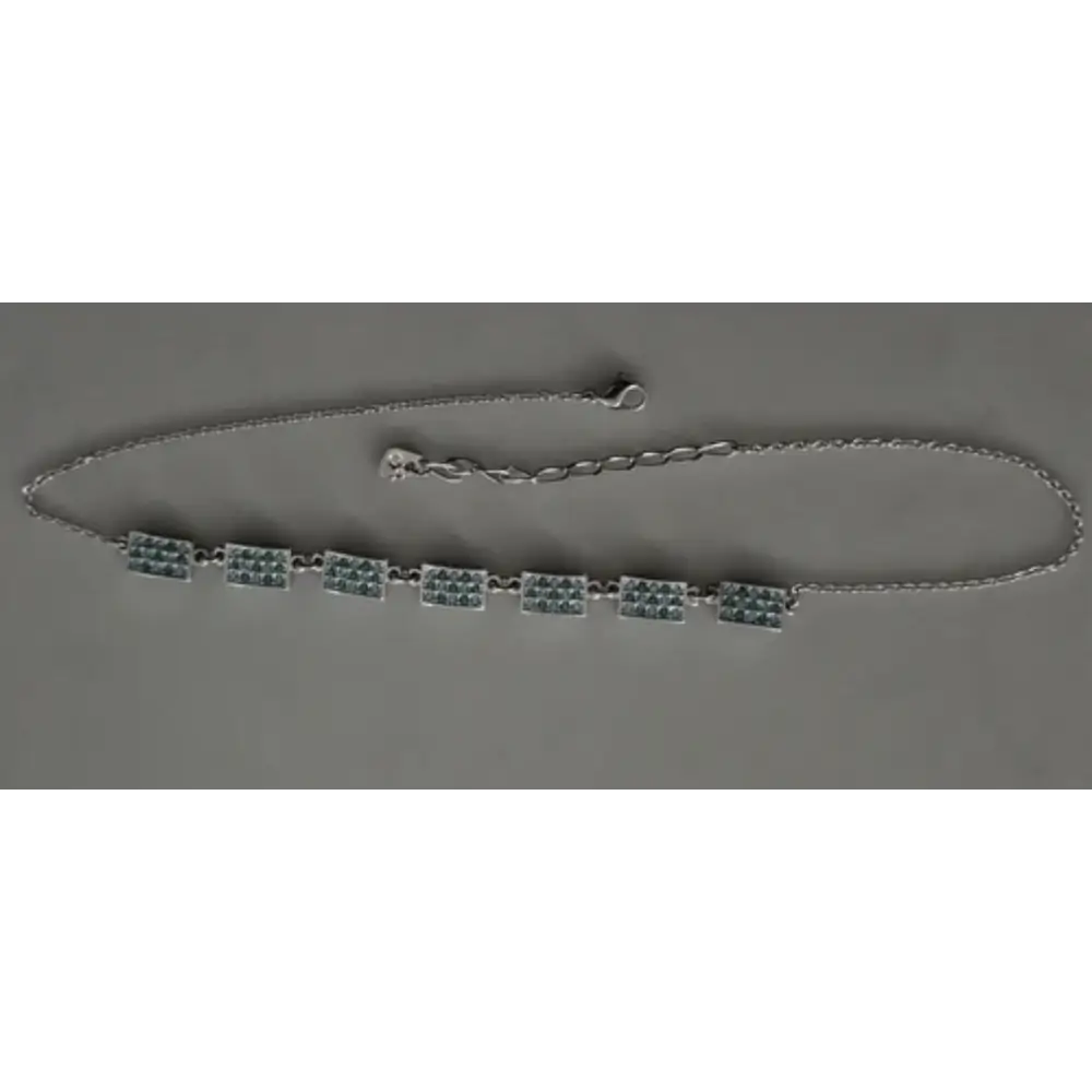 Necklace with green beads on a gray background