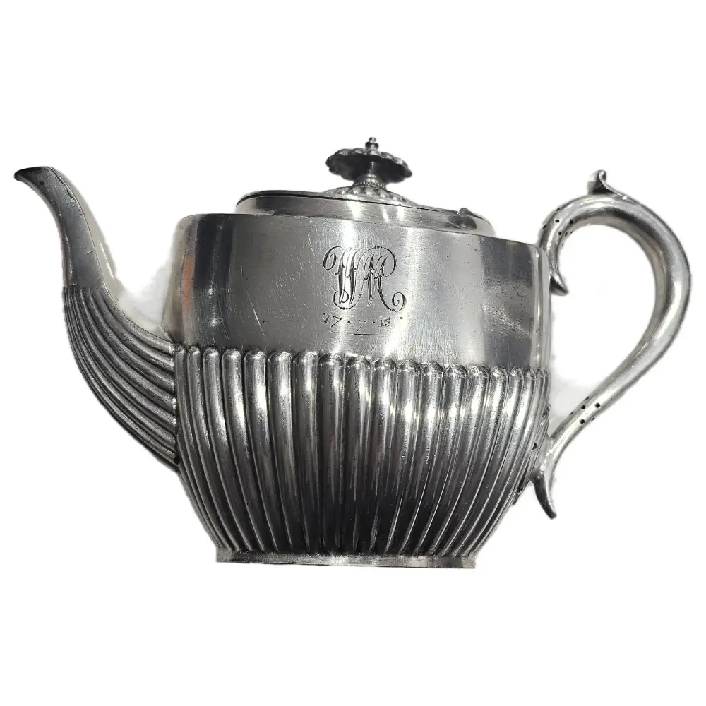 Silver teapot with ribbed design