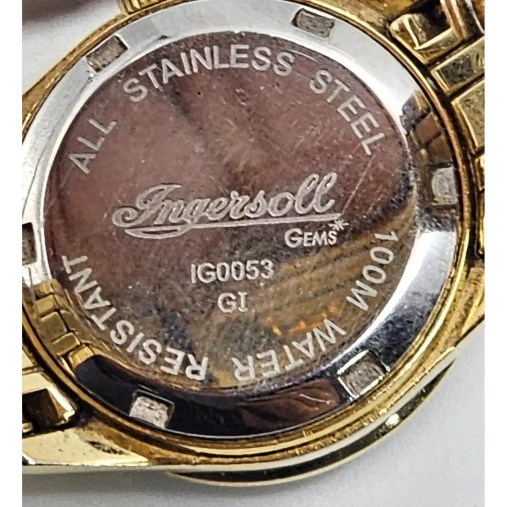 Ingersoll watch case with 'All Stainless Steel' and '100M Water Resistant'