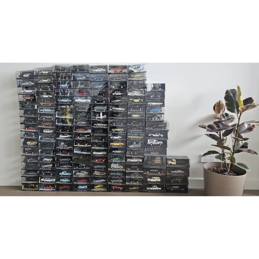 Stack of model car boxes on a shelf