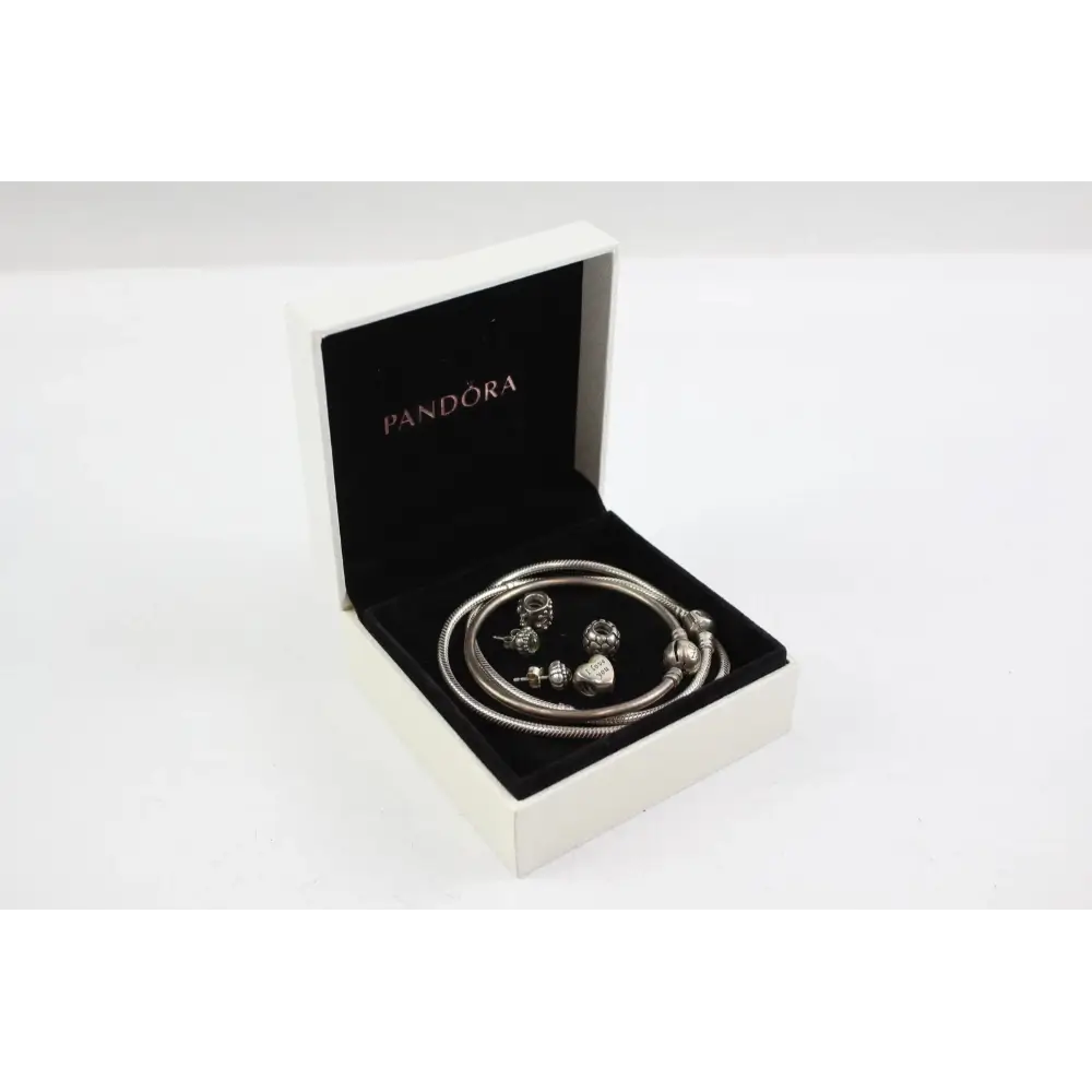 Pandora bracelet with charms in an open Pandora box