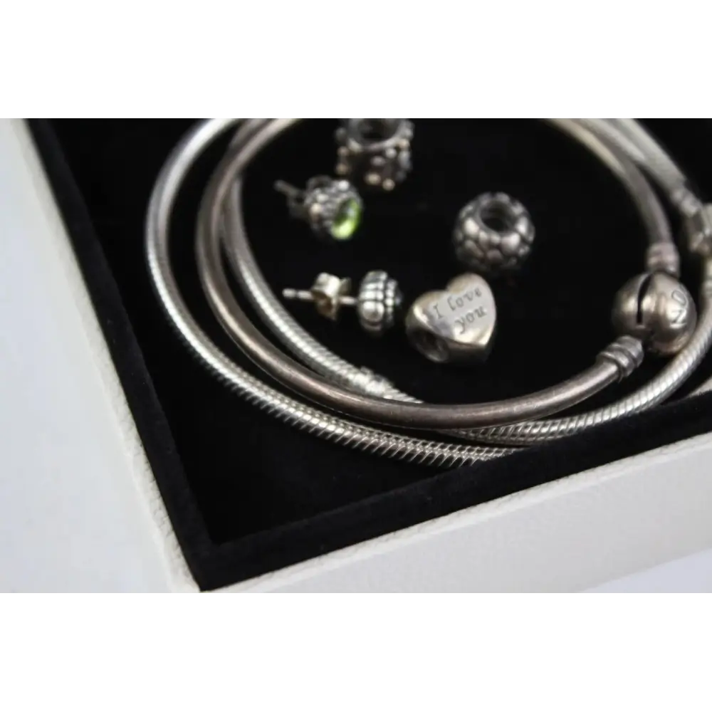 Silver bracelet with various charms