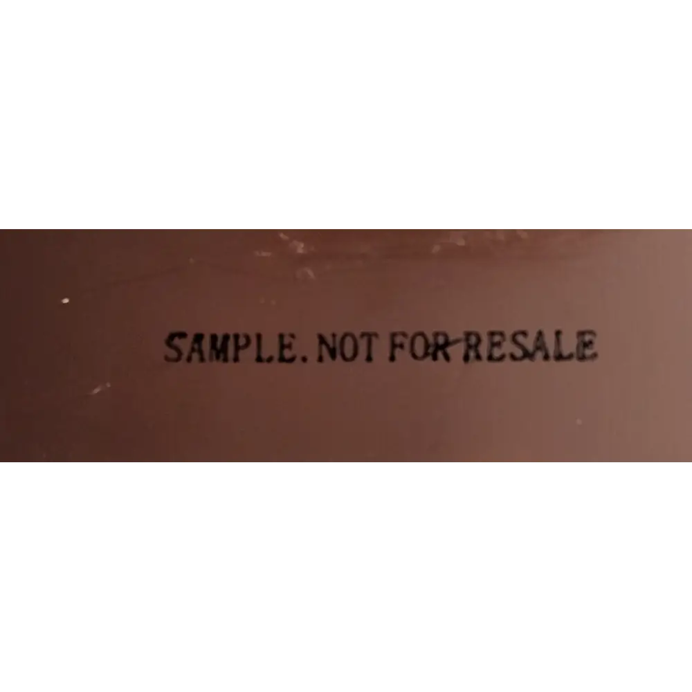 Text 'SAMPLE. NOT FOR RESALE' printed on a brown surface.