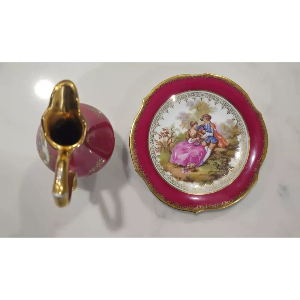 Decorative ceramic pitcher and saucer with floral