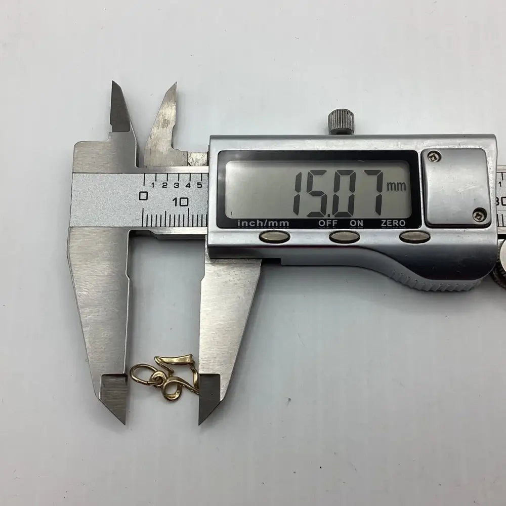 Digital caliper measuring a gold ring