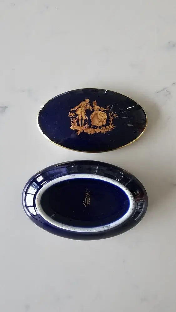 Two blue ceramic items with gold designs
