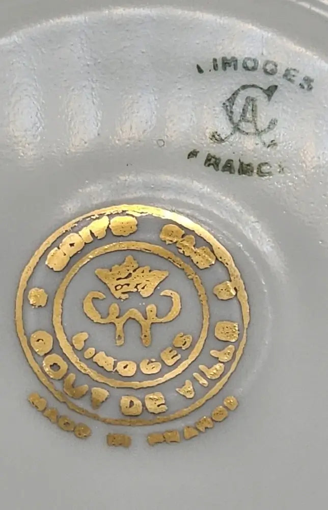 Close-up of Limoges porcelain mark on a gray background