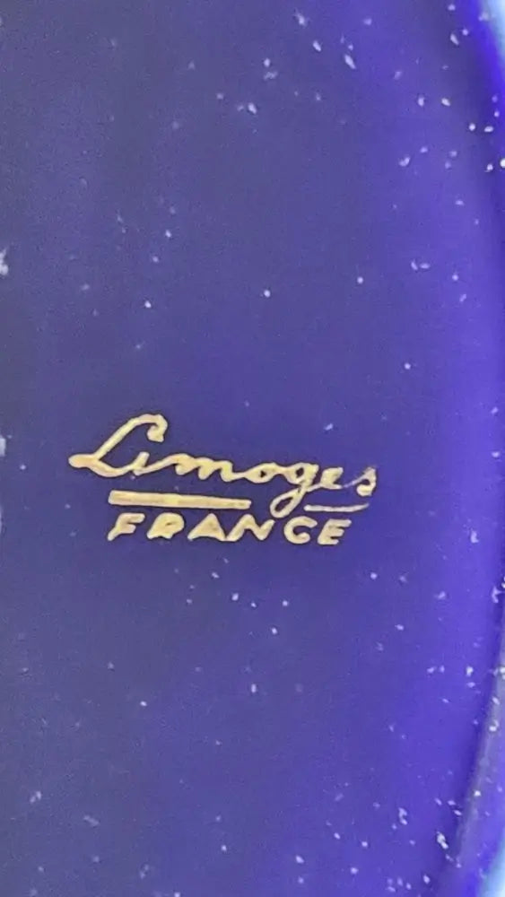 Blue ceramic plate with 'Limoges France' inscription