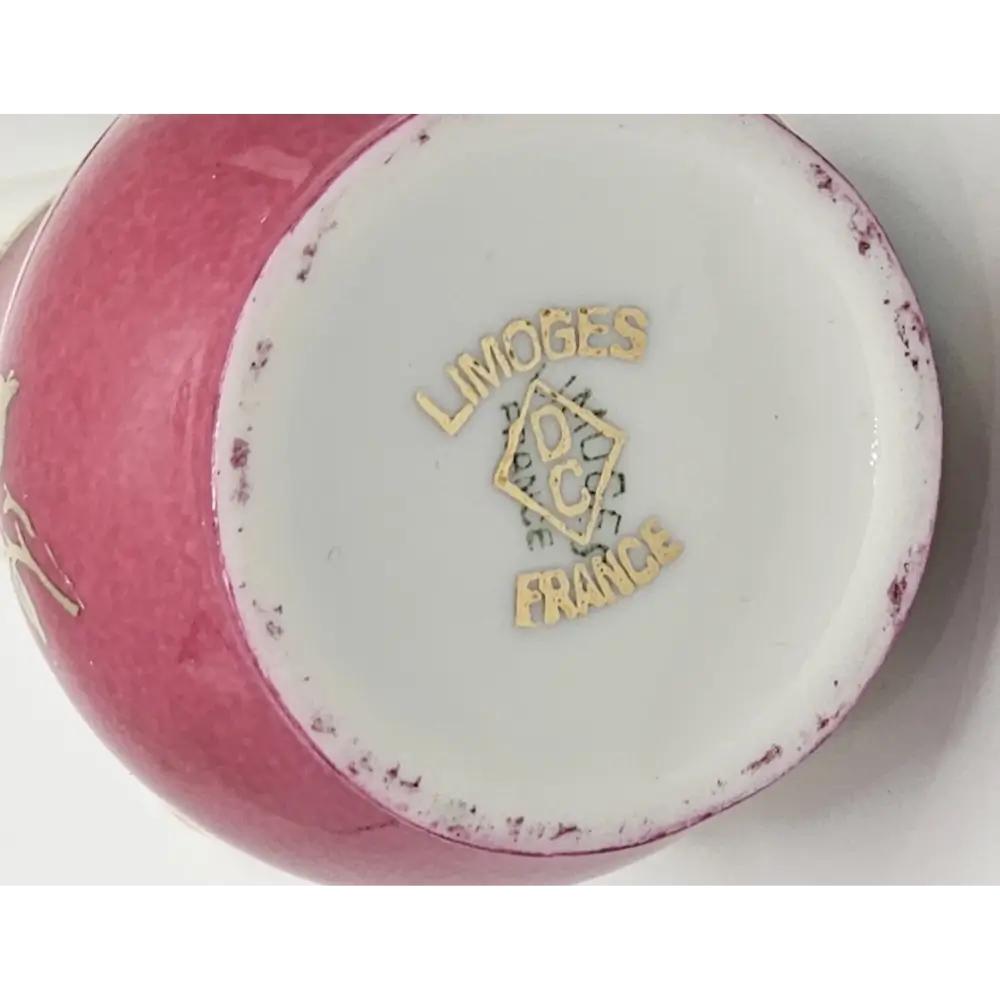 Pink ceramic pitcher with 'Limoges France' logo