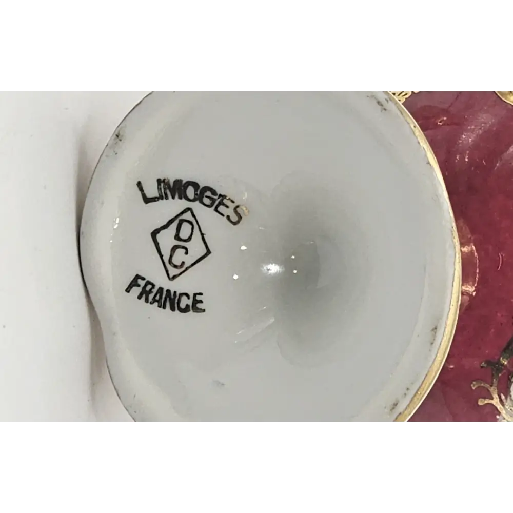 Close-up of a Limoges France ceramic item with a visible brand logo.