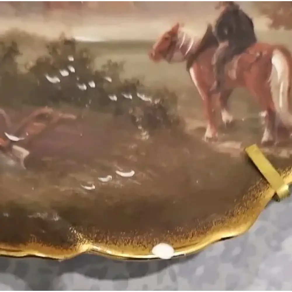 Horse crossing a river with a rider, surrounded by trees and wate