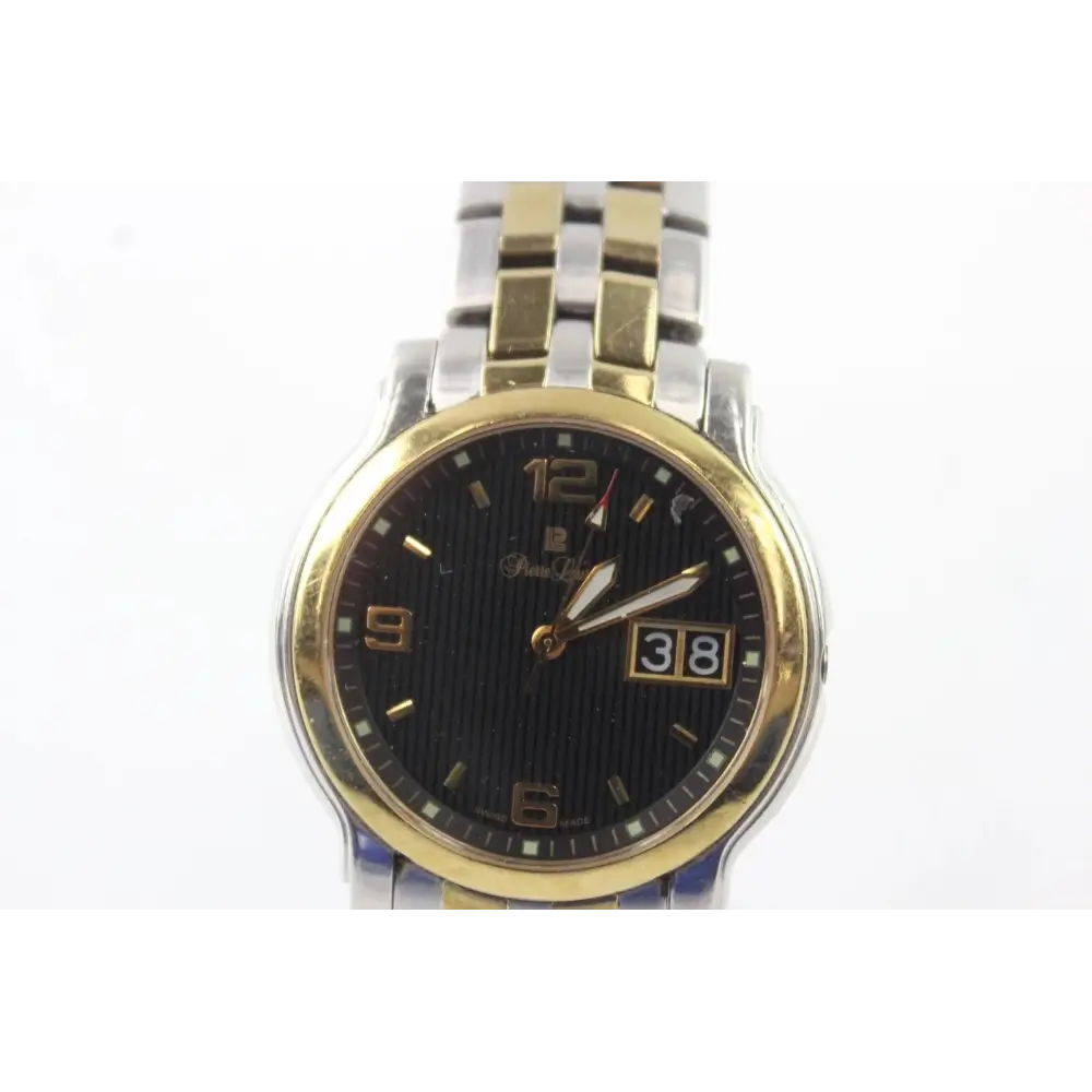 Two-tone watch with gold and silver band on a white background