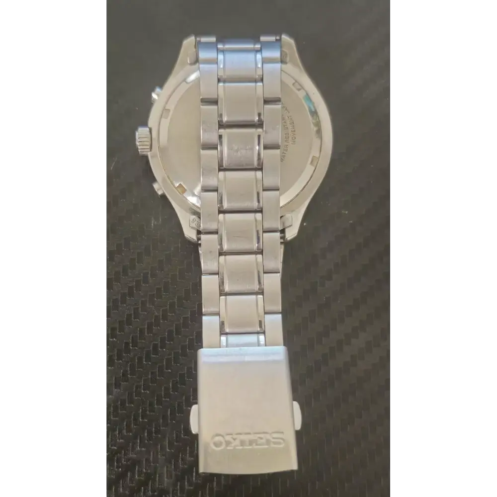 Silver watch with a detailed back