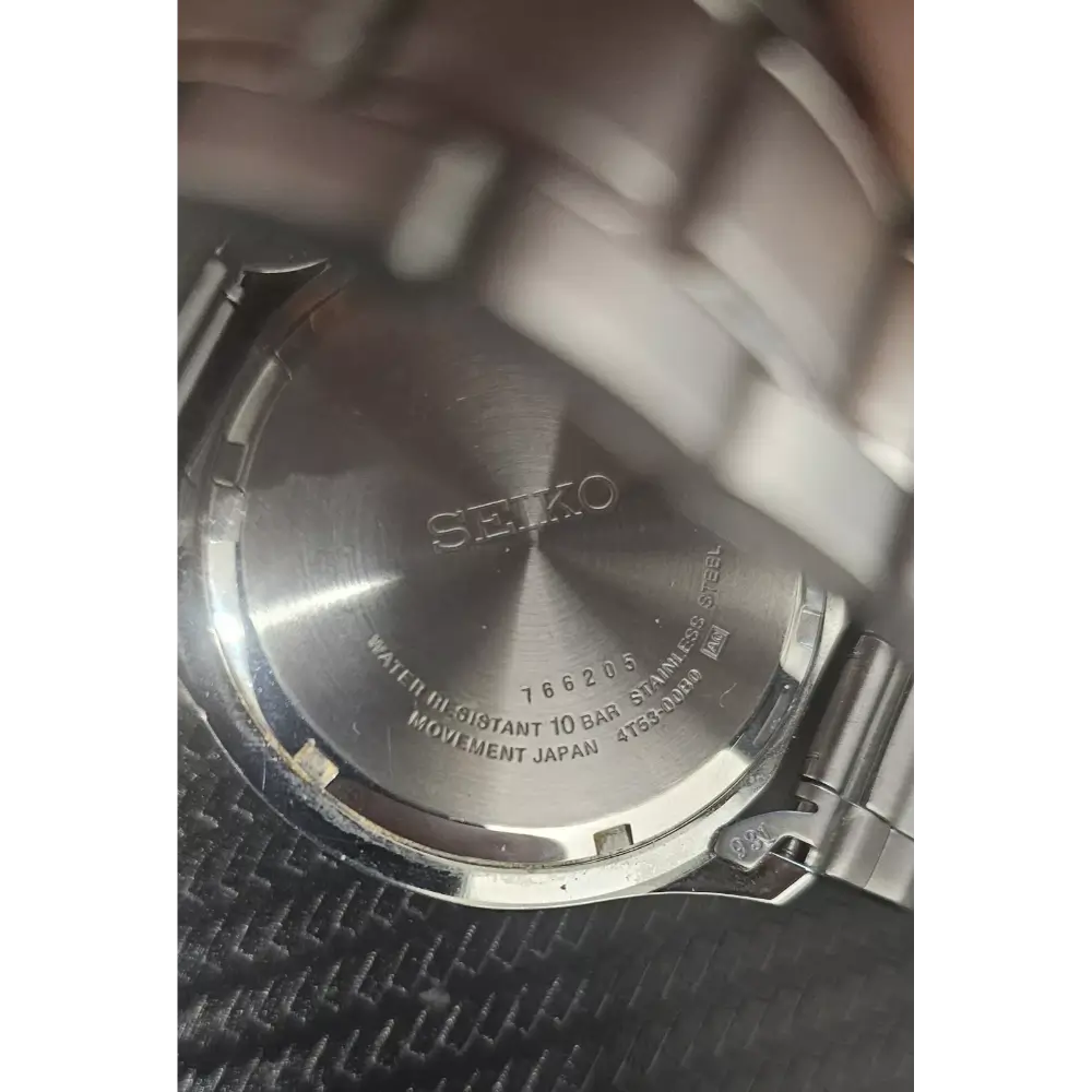Close-up of a Seiko watch back cover with text on a white background