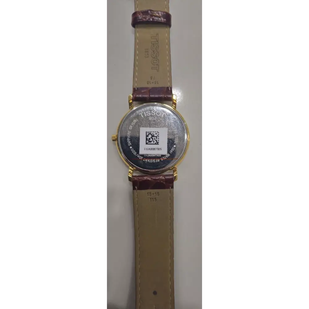 Wristwatch with a brown strap and gold case