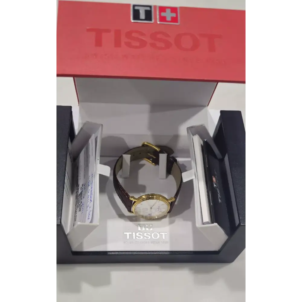 Tissot watch in a display case with Tissot branding.