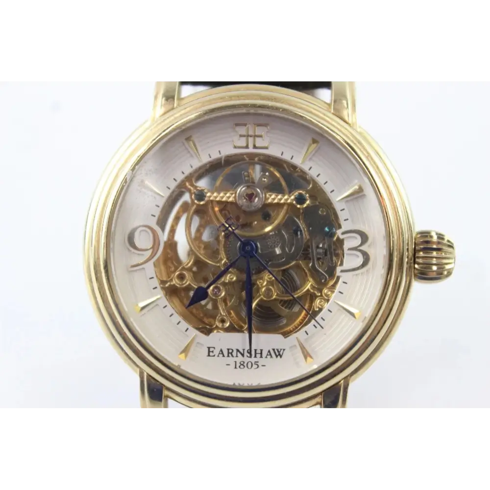 Gold wristwatch with visible mechanical components