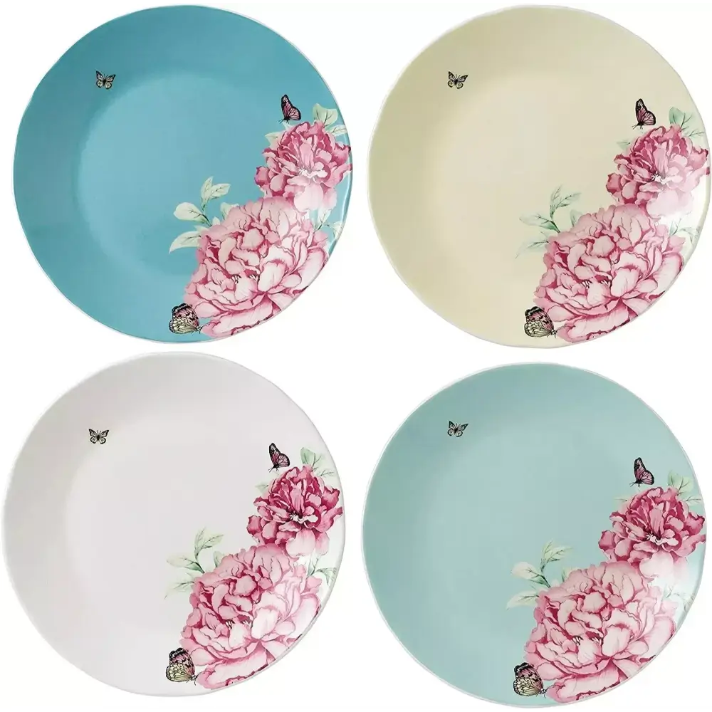 Four ceramic plates with floral designs