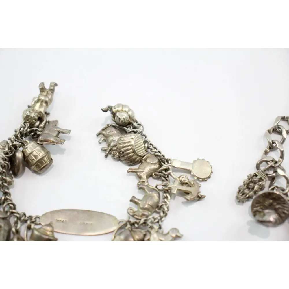 Silver charm bracelet with various charms