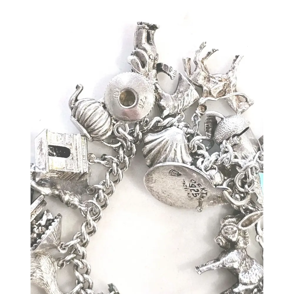 Silver charm bracelet with various charms
