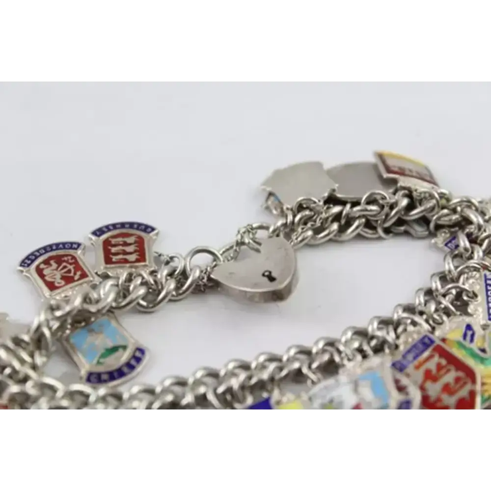 Silver charm bracelet with various charms