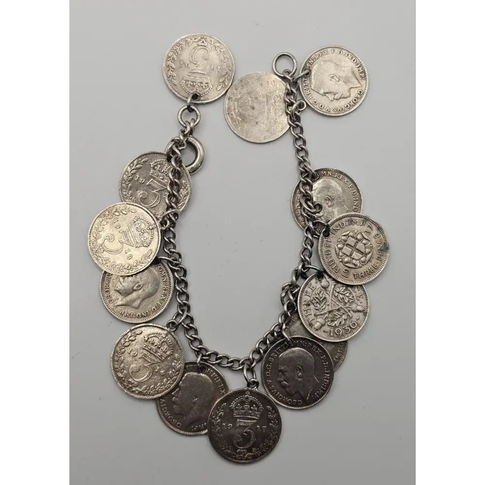 Bracelet made of vintage coins on a gray background