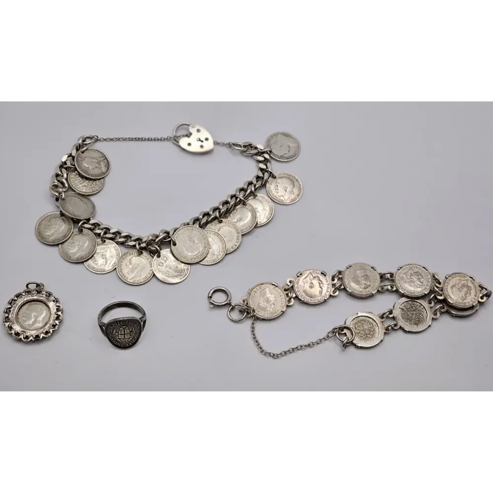 Silver coin jewelry set including bracelets