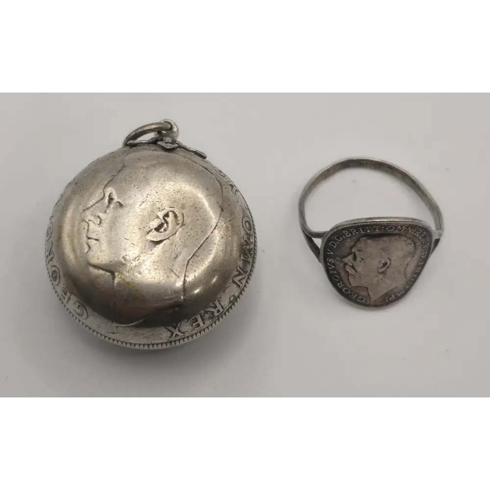 Silver locket and ring with engraved face