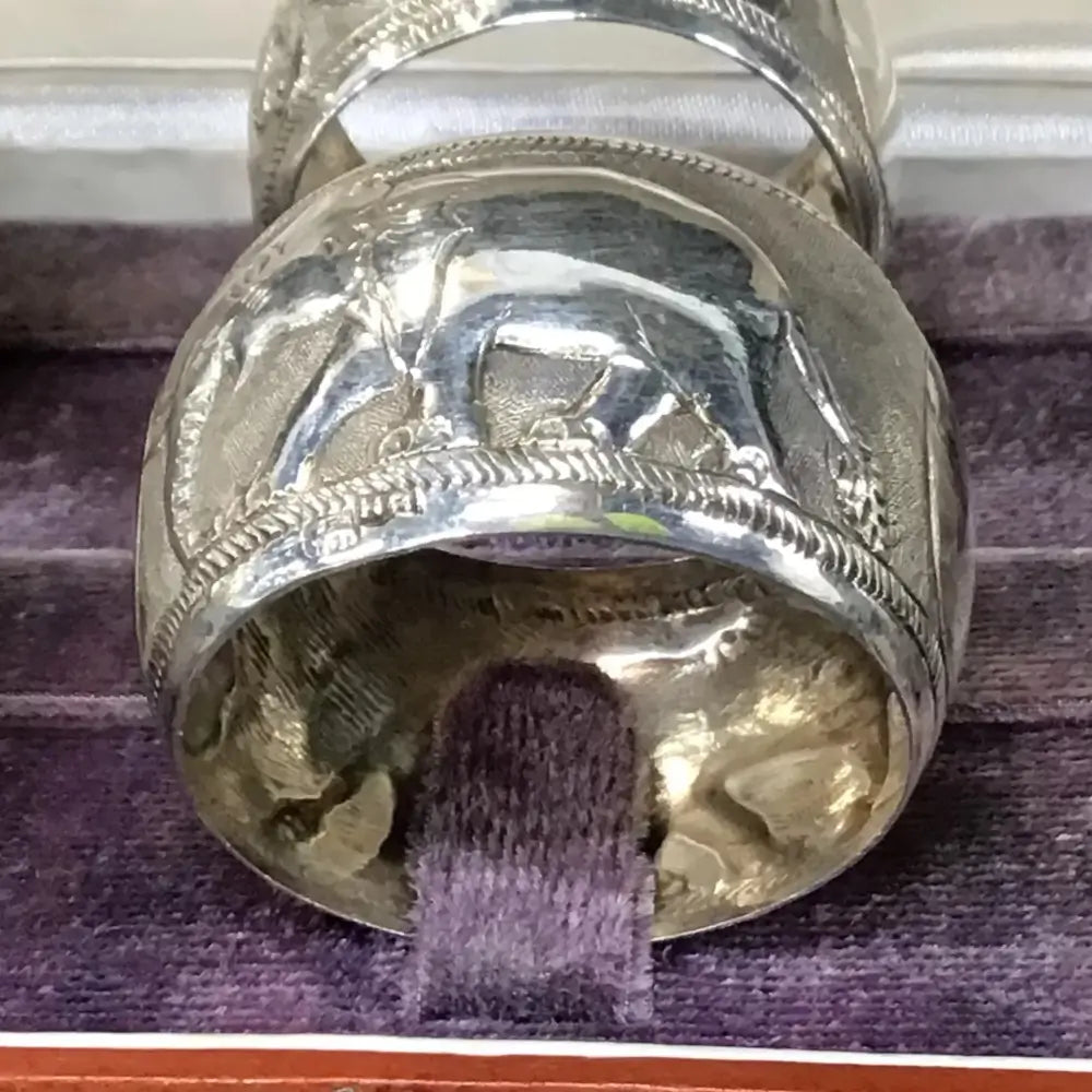 Close-up of a silver and gold Napkin Rings