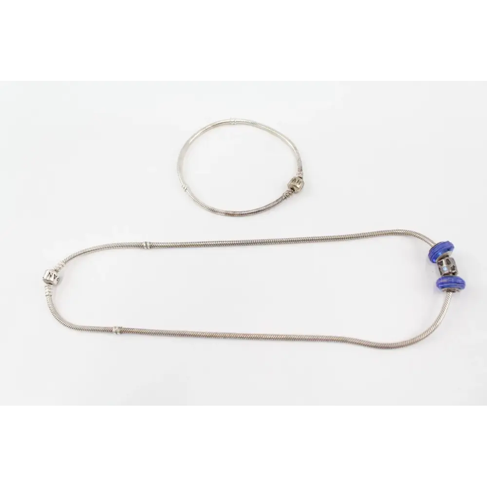 Metallic necklace with a blue clasp