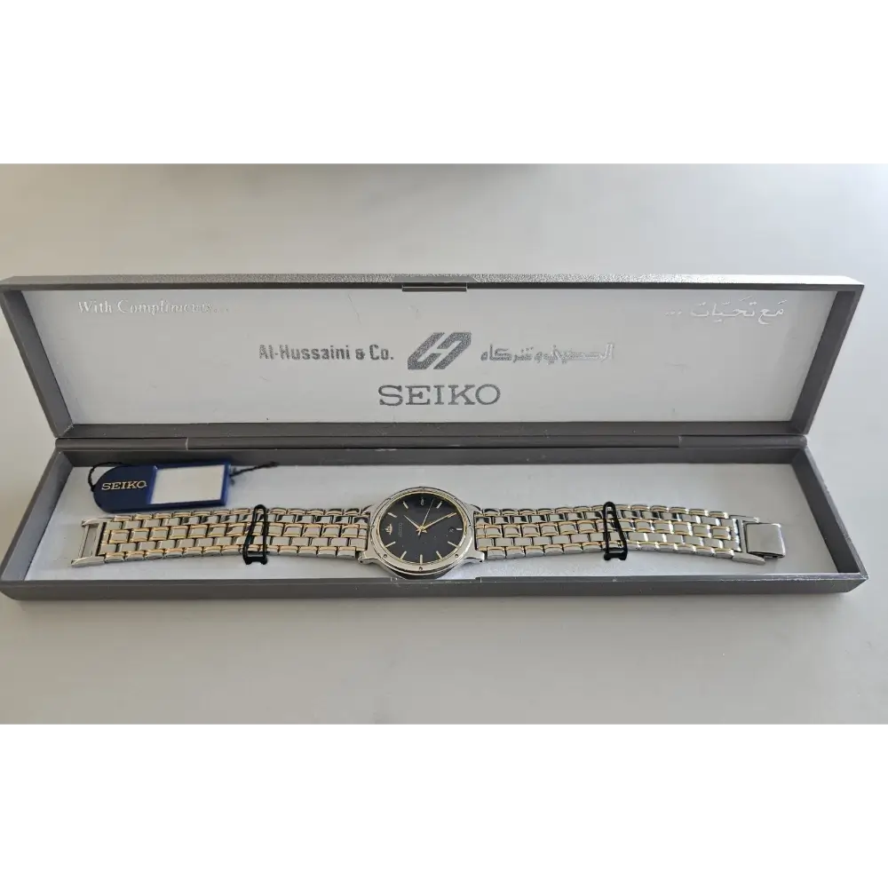 Seiko watch in an open box on a white background