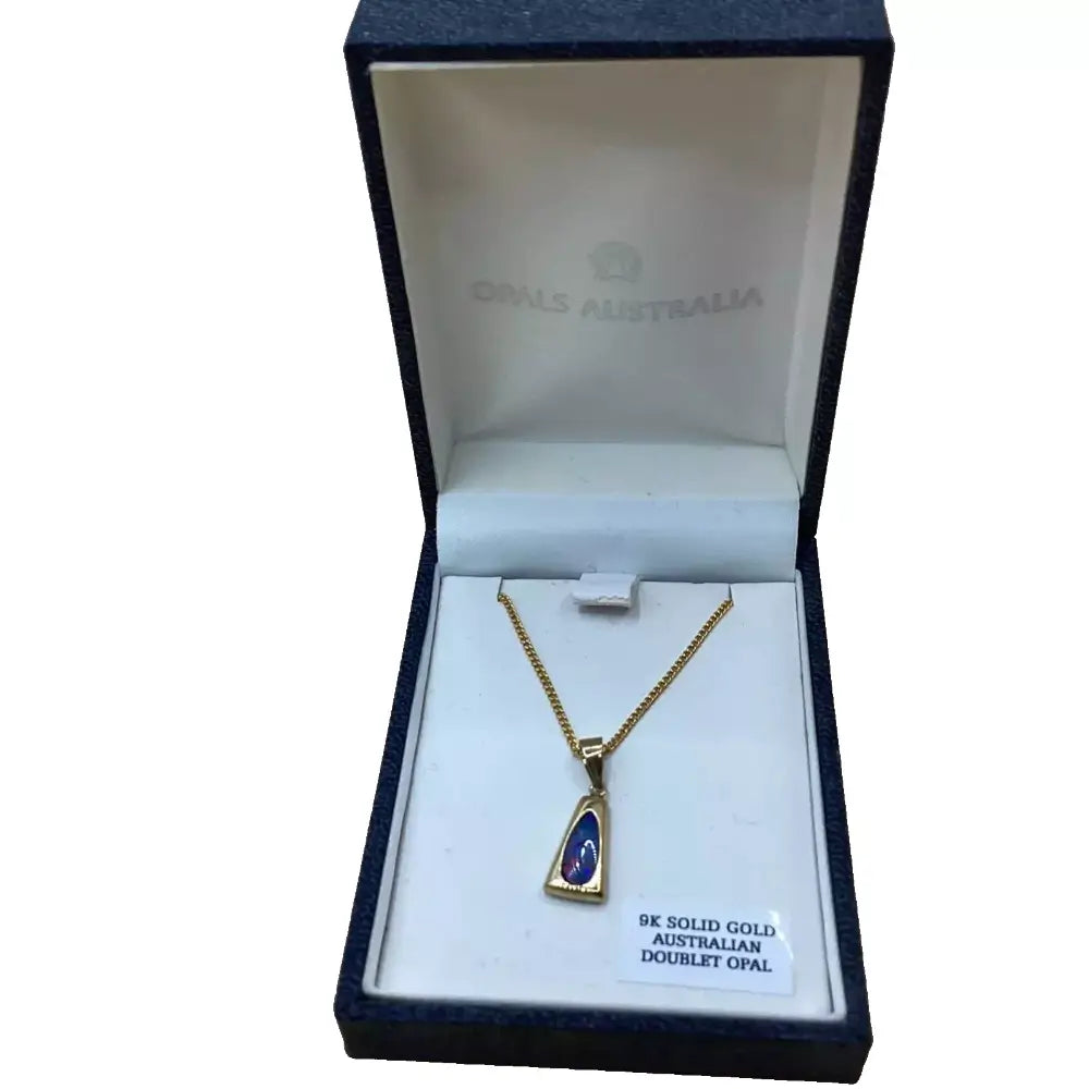 Gold necklace with pendant in a 'Opals Australia' jewelry box