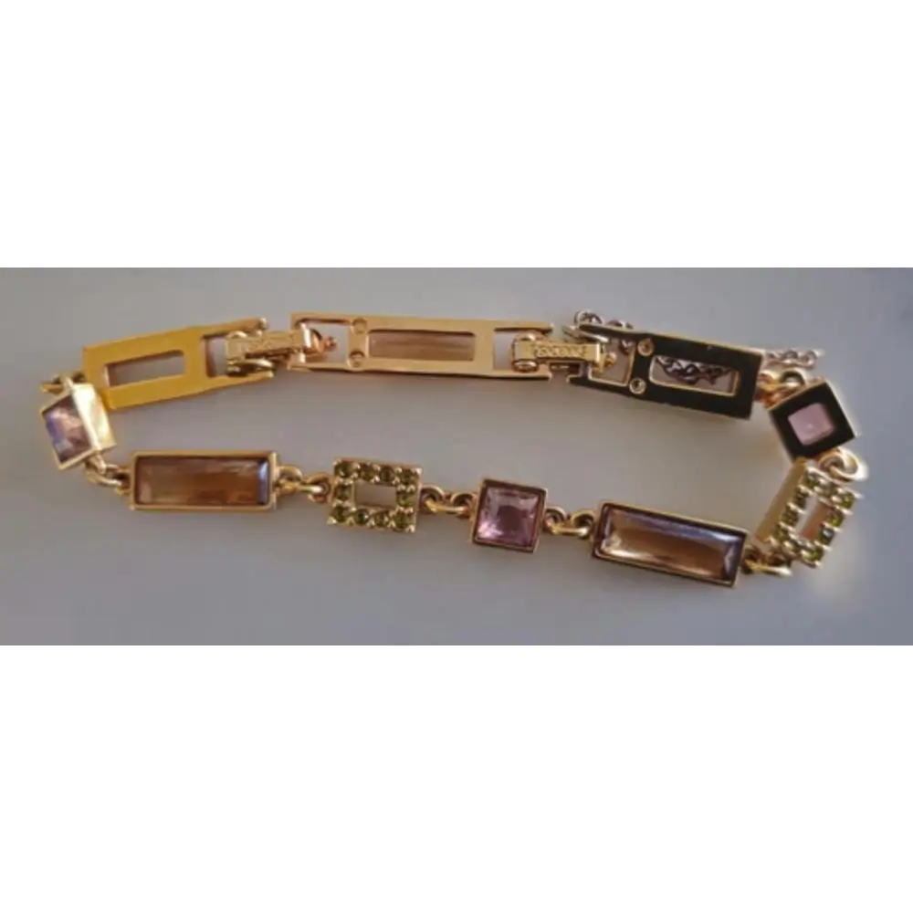 Gold bracelet with gemstone accents