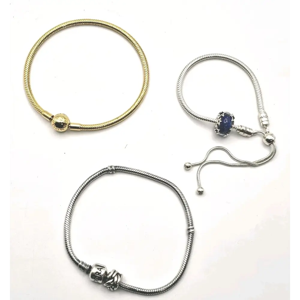 Three bracelets in gold, silver, and a combination of gold and silver