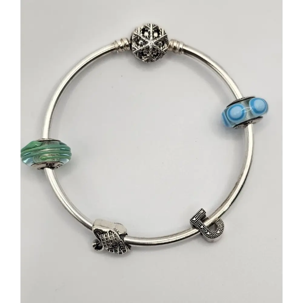 Silver bracelet with various charms