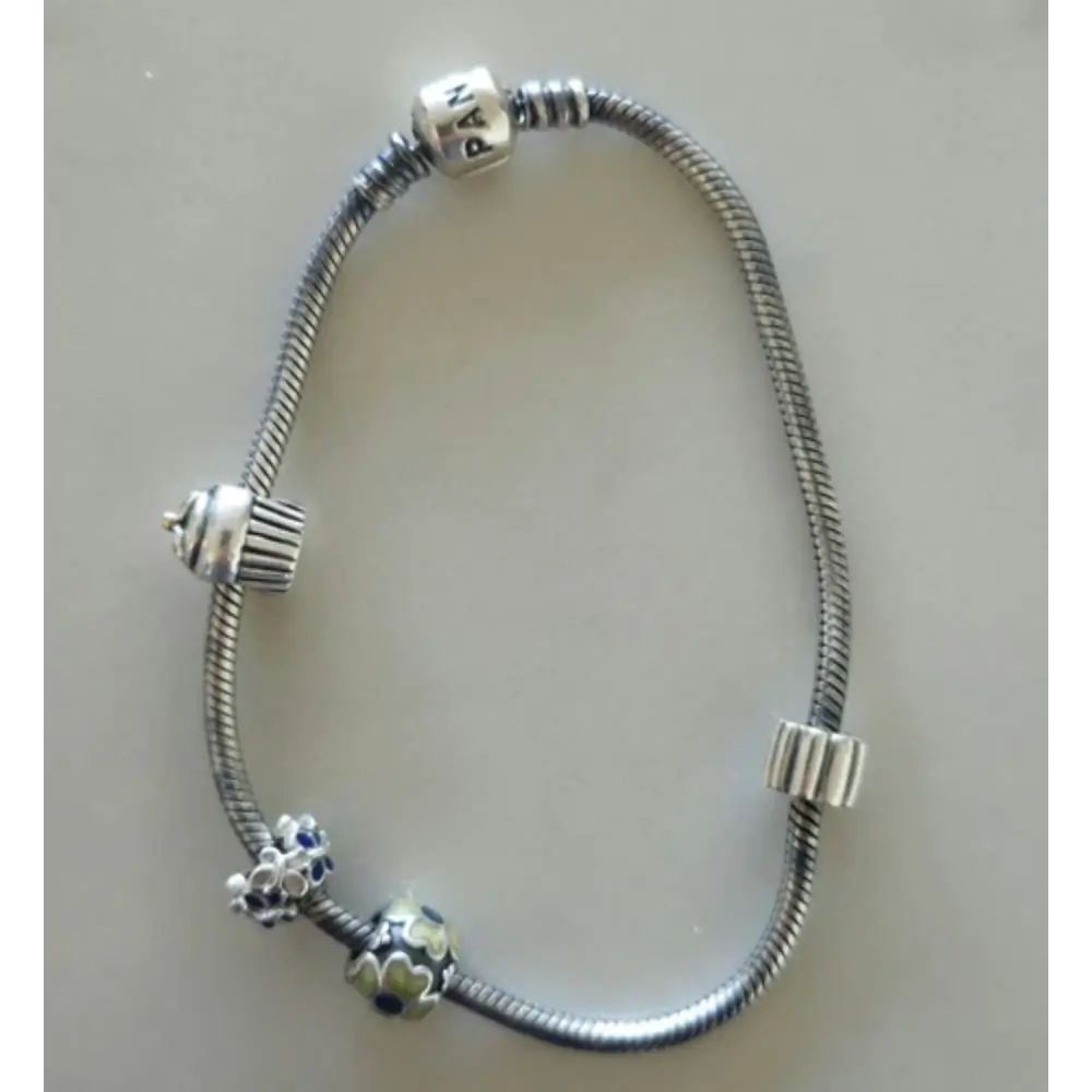 Silver bracelet with charms