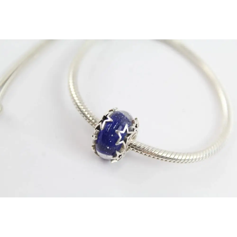 Silver bracelet with a blue star-shaped charm