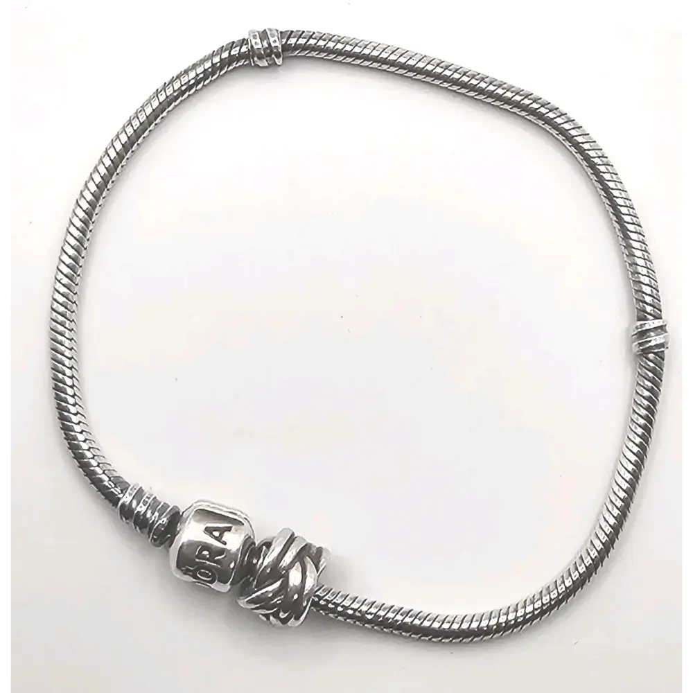 Silver bracelet with a clasp on a white background