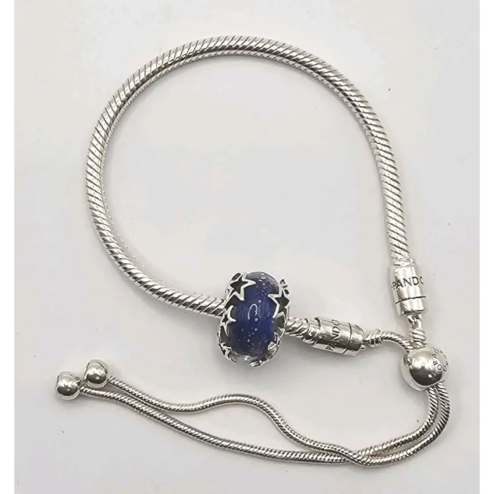 Silver bracelet with a blue heart-shaped charm
