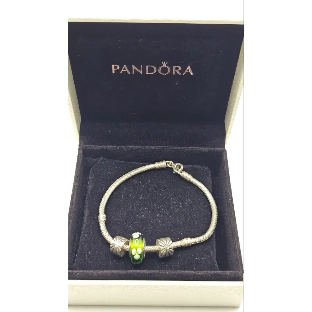 Pandora bracelet with a green charm