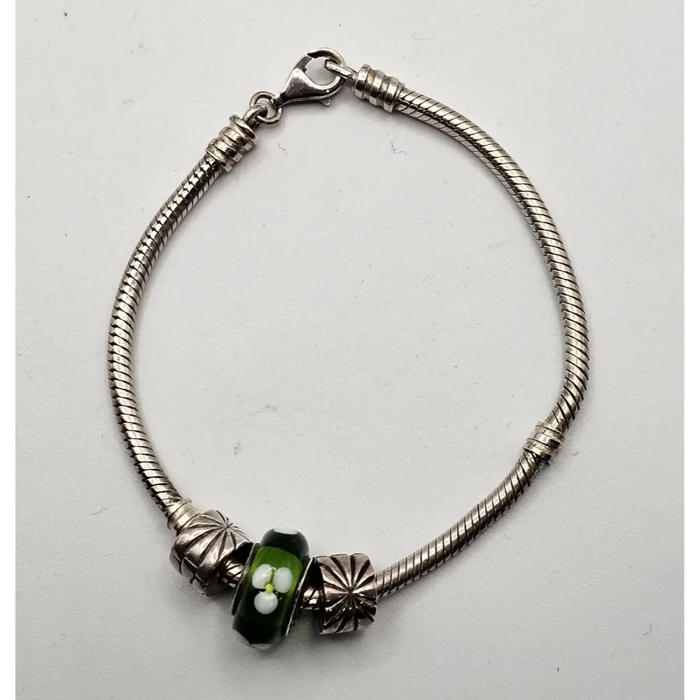 Silver bracelet with a green bead