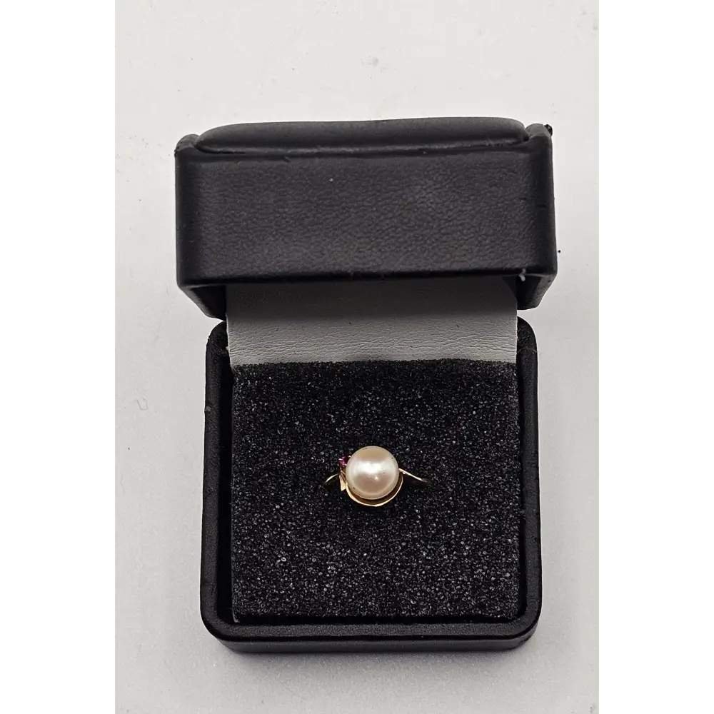 Pearl ring in a black jewelry box