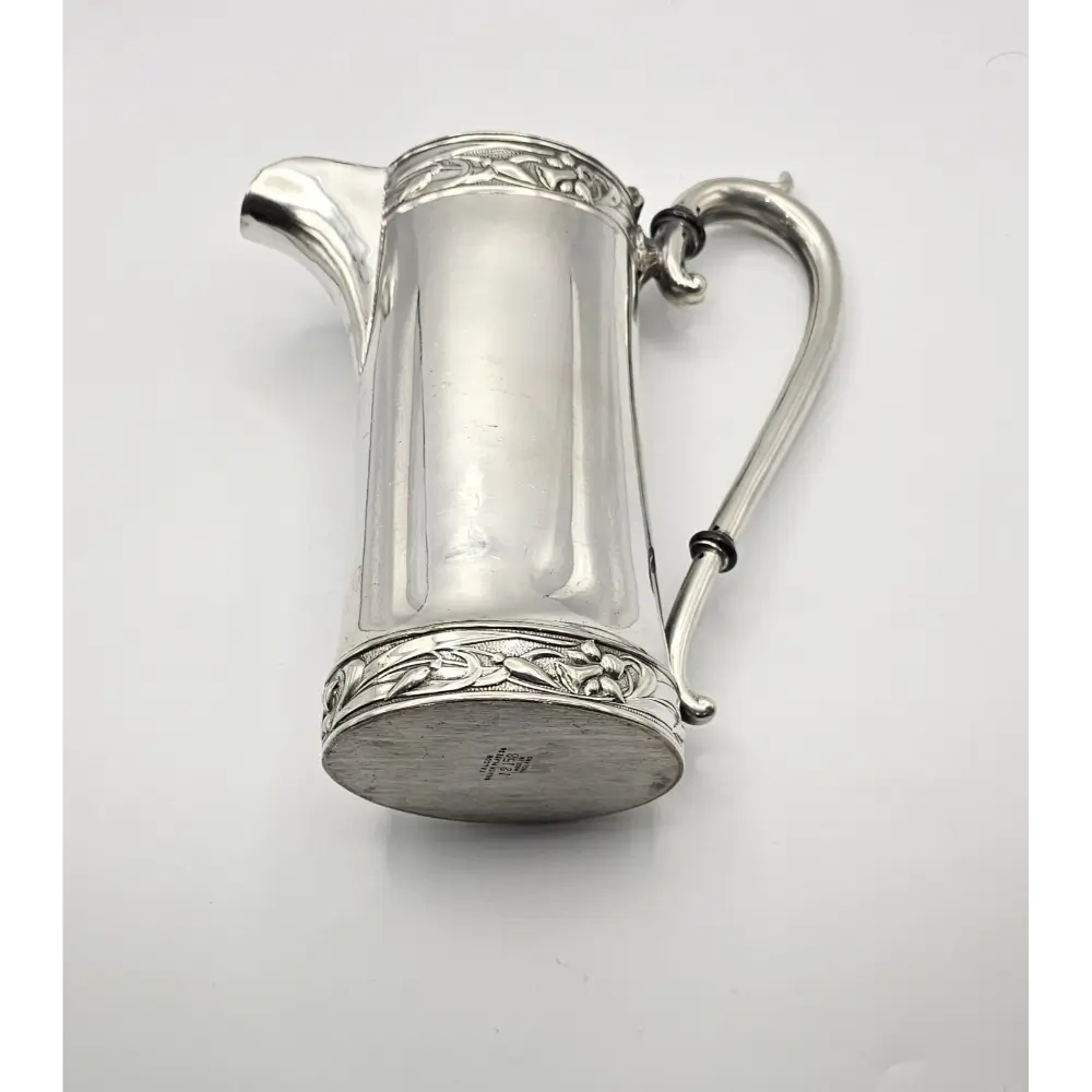 Silver pitcher with decorative elements