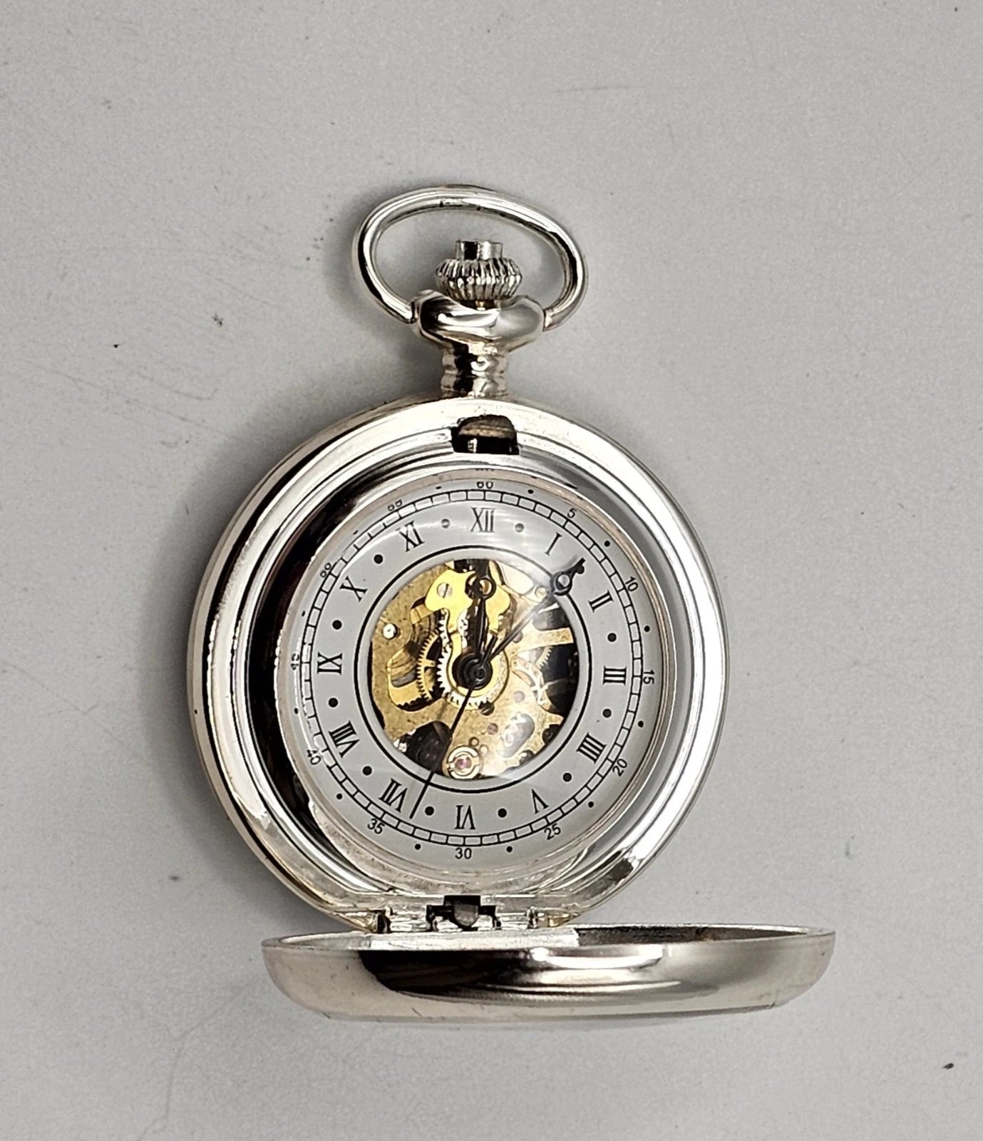 Silver pocket watch with open fac