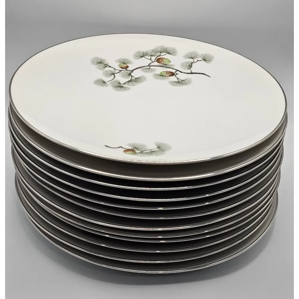 Stack of decorative plates with nature-themed design