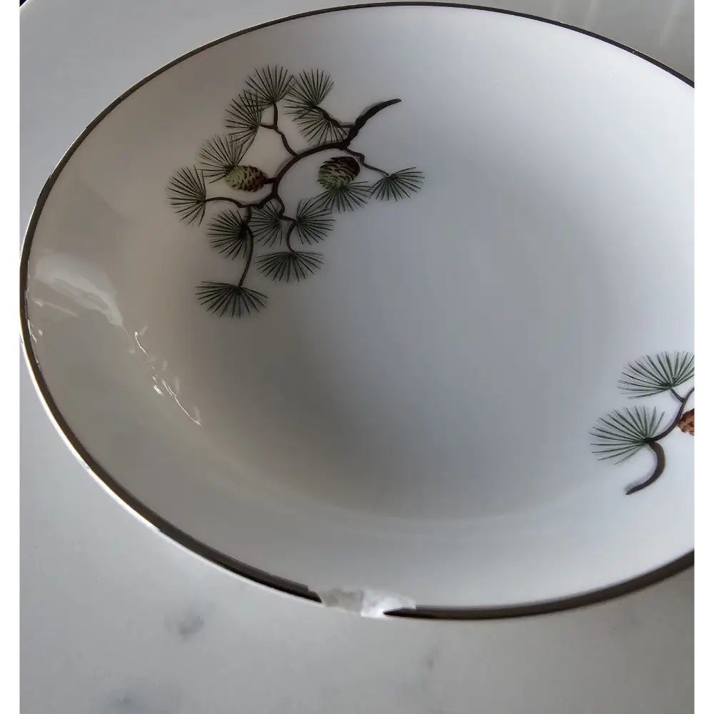 White ceramic bowl with black floral design