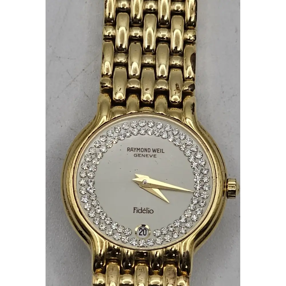 Gold watch with diamond-studded face