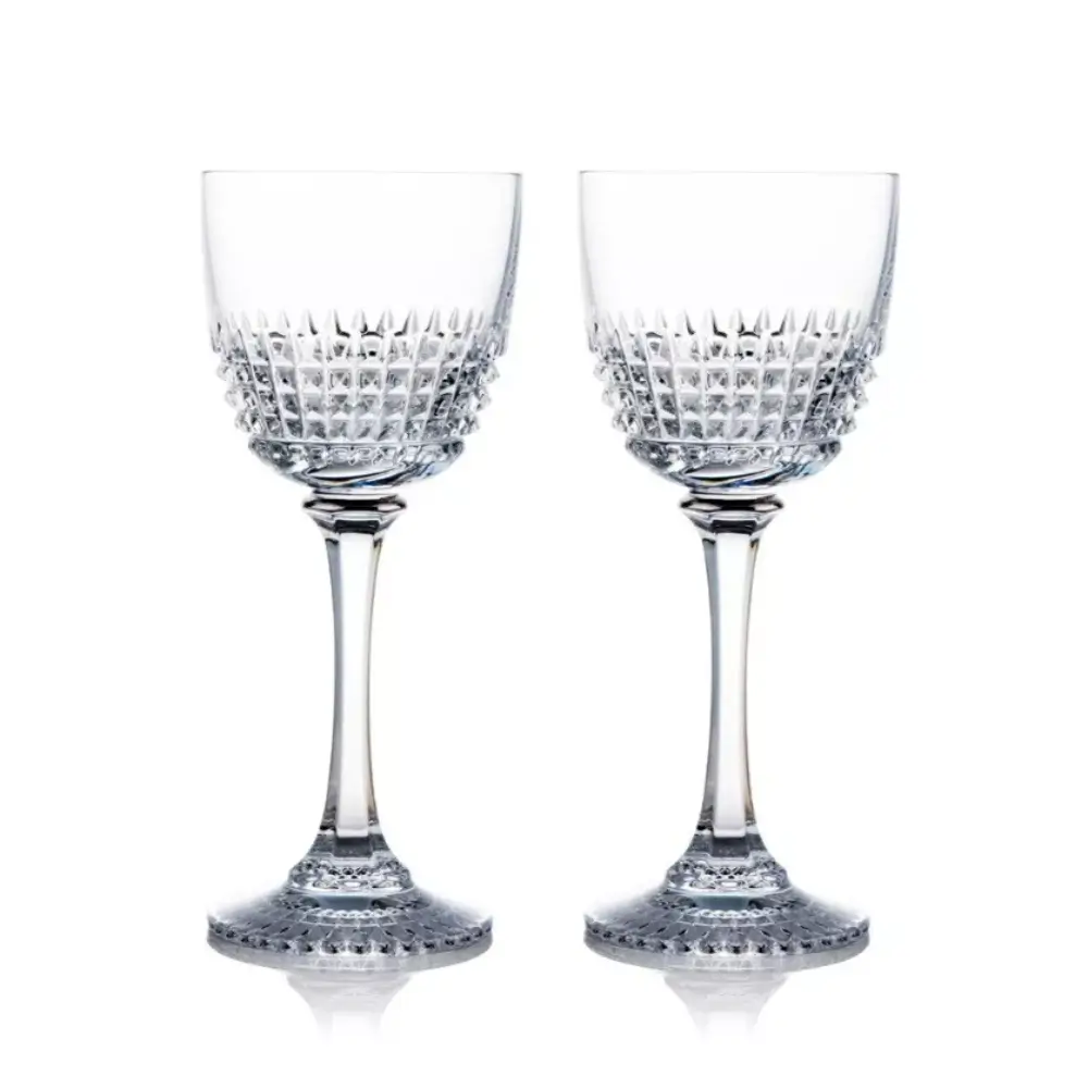 Two crystal wine glasses with intricate designs