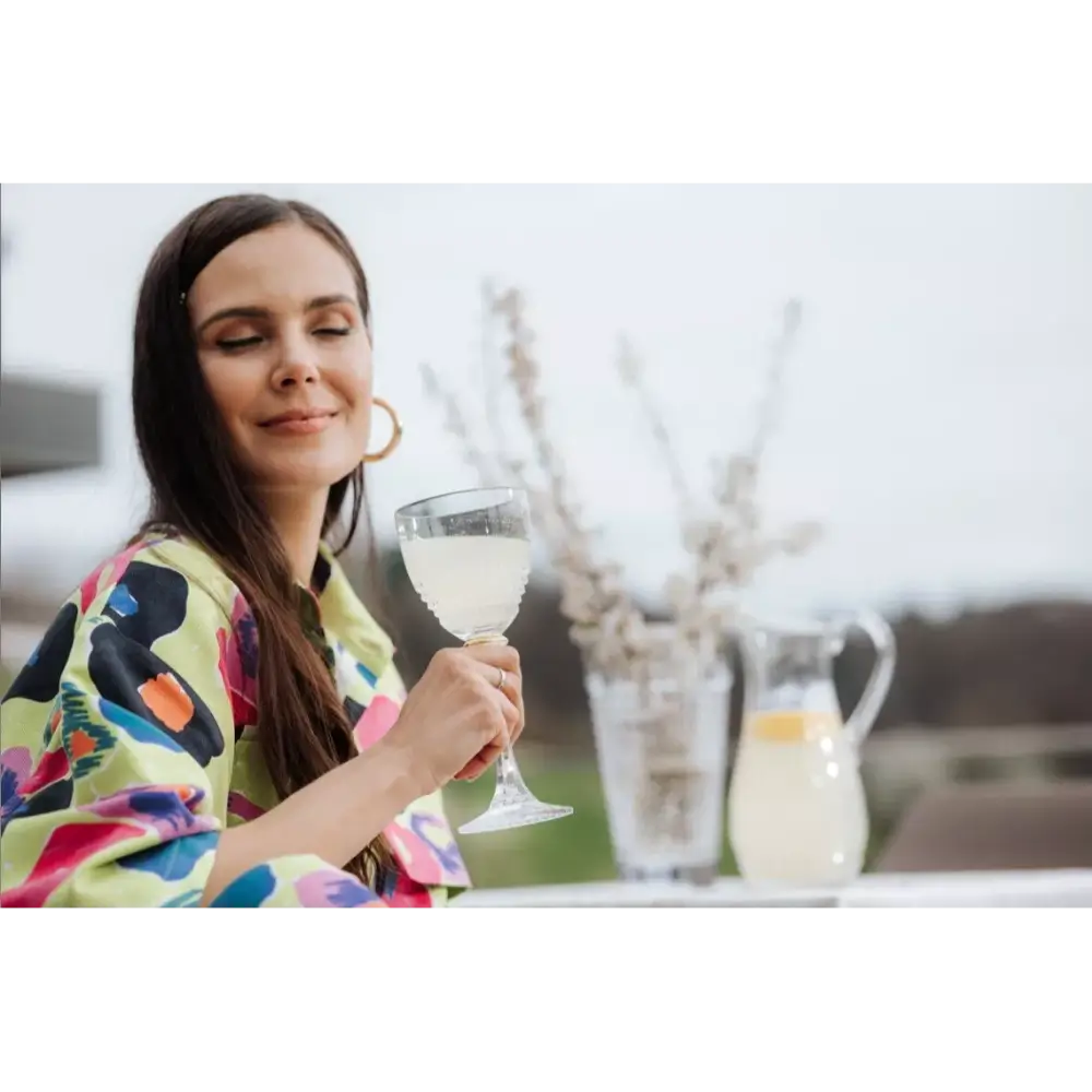 Woman holding a glass of white wine