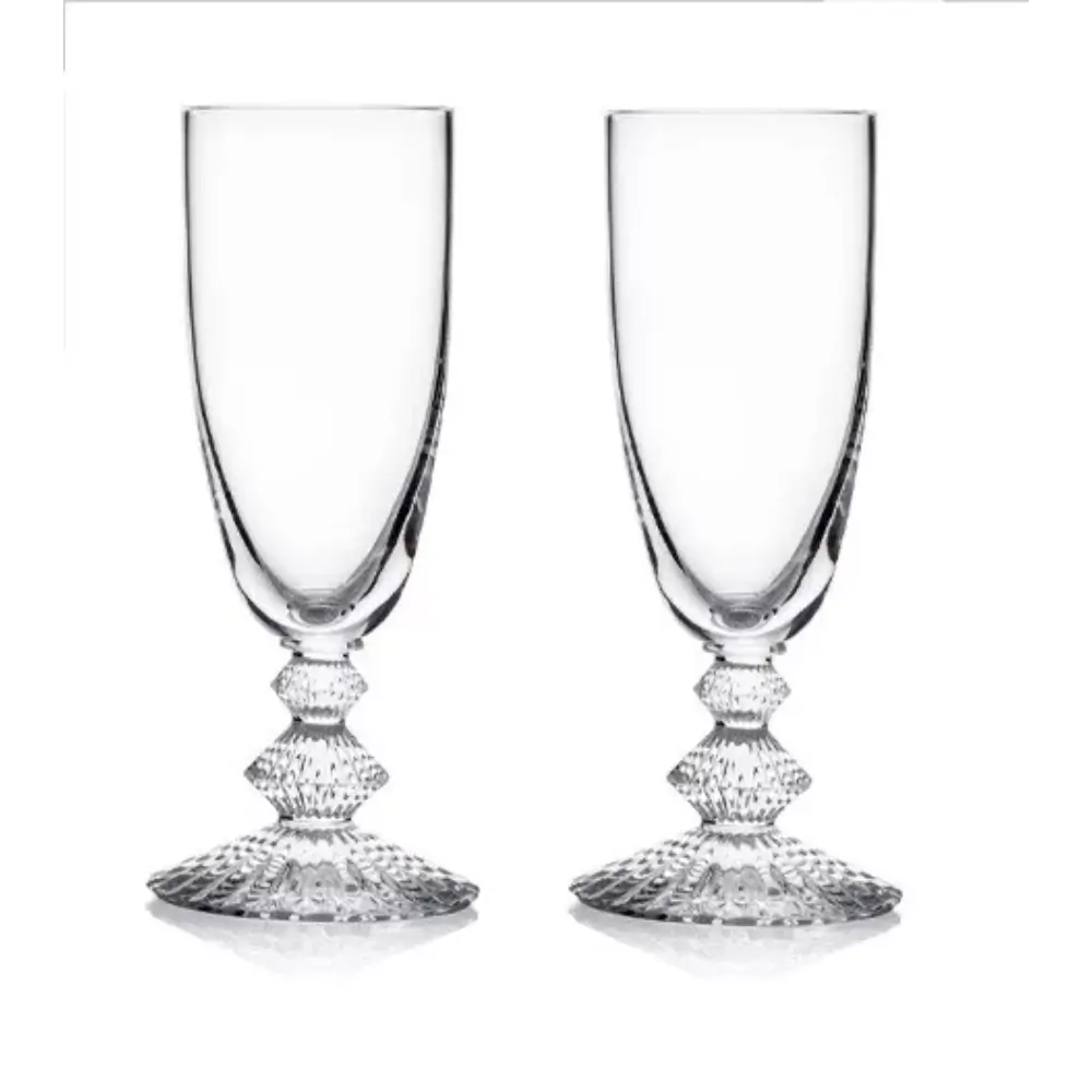 Two clear glass goblets with decorative bases